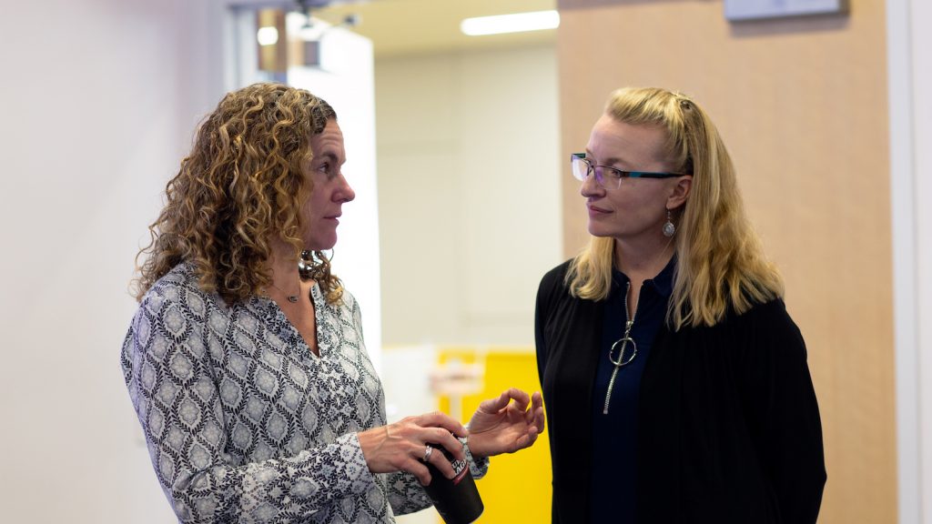 two faculty discussing DELTA grants