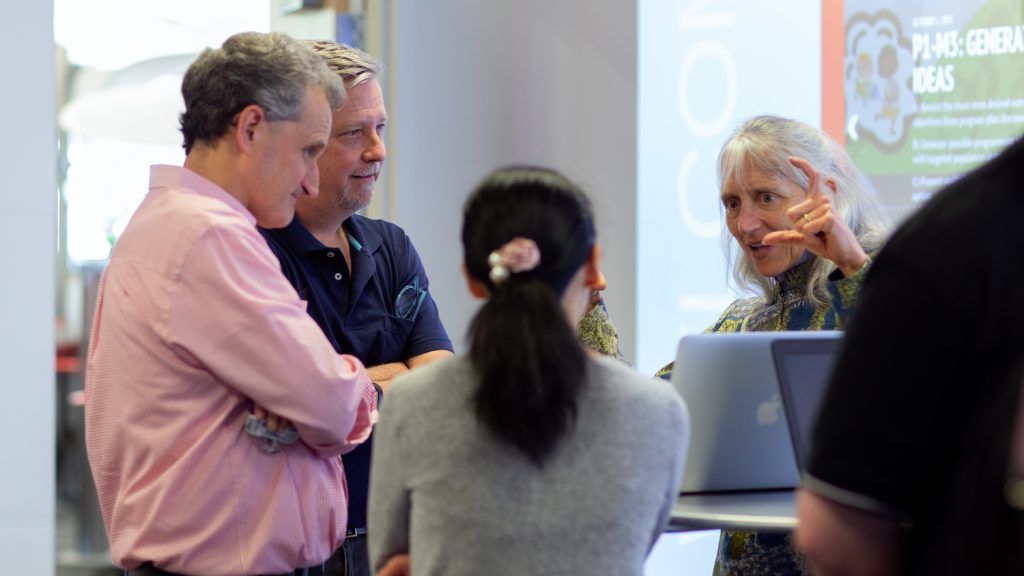 faculty member discusses DELTA Grant with DELTA staff